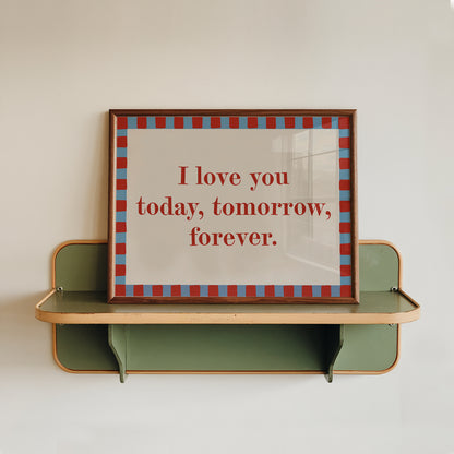 Decorative shelf with a framed quote on a plain wall